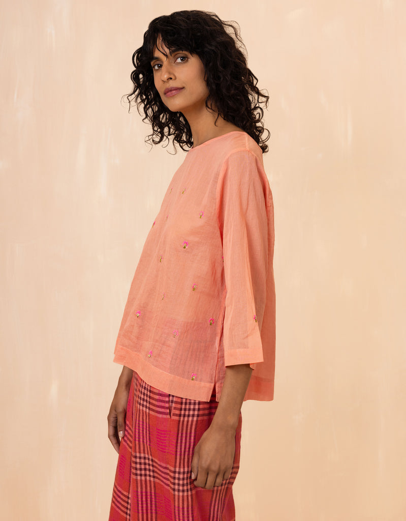Oilily blouse in orange cotton voile, with vibrant hand-applied floral embroidery 